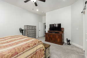 Bedroom with light colored carpet, a ceiling fan, a textured ceiling, and recessed lighting