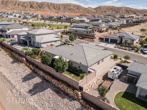 Aerial perspective of suburban area with a mountainous background
