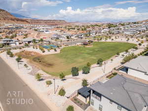 Aerial view of residential area featuring a mountainous background