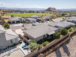 Aerial perspective of suburban area featuring a mountain backdrop