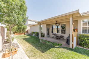 Back of property featuring stucco siding, a patio, and ceiling fan