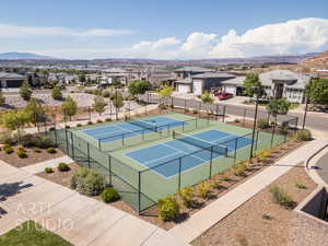 View of tennis court with a mountain view and a residential view