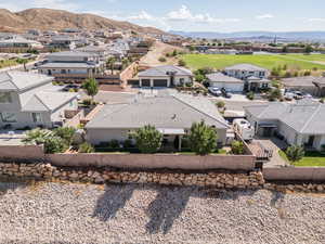 Aerial perspective of suburban area with a mountainous background