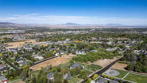 View of property location featuring mountains and nearby suburban area