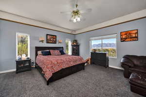 Bedroom with carpet floors, a mountain view, and ceiling fan