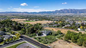 View of property location featuring a mountainous background and nearby suburban area