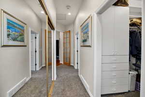 Corridor featuring carpet, recessed lighting, and attic access