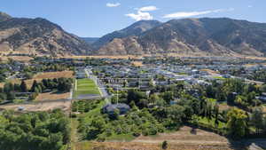 Mountain view featuring nearby suburban area and a tree filled landscape