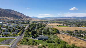 Aerial perspective of suburban area featuring a mountainous background