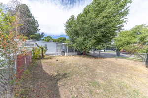 View of yard with a sunroom