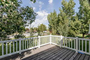 Wooden deck featuring a yard