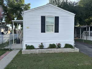 View of front of property featuring a gate