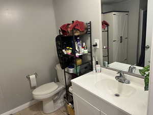 Bathroom featuring light tile patterned floors and vanity