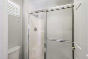 Castita Bathroom with toilet and a shower stall