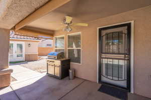 View of patio featuring a ceiling fan and french doors