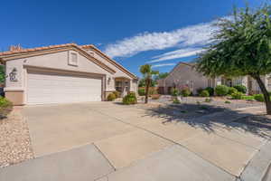 Mediterranean / spanish house with concrete driveway, stucco siding, and a garage