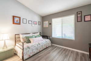 Bedroom with light wood-style floors