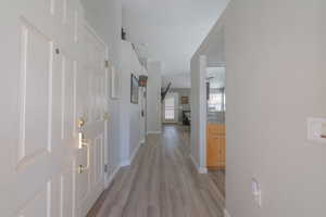 Entry Hallway featuring light LVP floors and baseboards