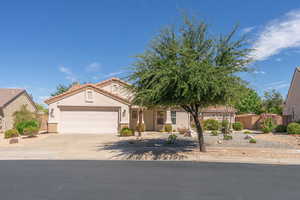 Mediterranean / spanish-style home with driveway, a garage, stucco siding, and a tiled roof