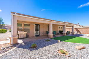 Rear view of house featuring a patio and stucco siding
