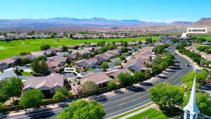 Aerial perspective of suburban area with mountains. CLOSE TO CLUBHOUSE