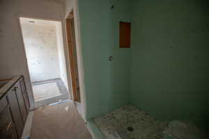 Full bath with vanity and a shower