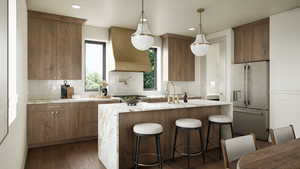 Rendering - Kitchen with a kitchen bar, stainless steel appliances, light stone counters, dark wood-type flooring, and wall chimney range hood
