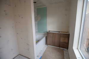 Full bath featuring a tub and vanity