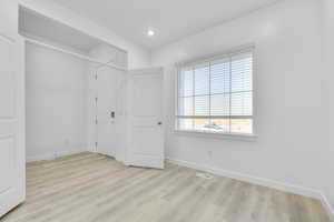 Unfurnished bedroom featuring light wood-style flooring and recessed lighting