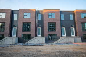 Contemporary home with brick siding