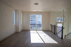 Living room featuring hardwood / wood-style flooring and a textured ceiling