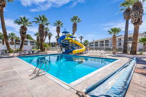 Community pool featuring a water slide!