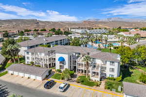 Drone / aerial view of mountains and apartment complex / building
