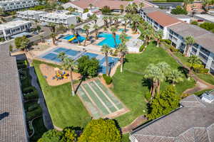 Aerial view of a pool and apartment complex / building