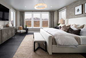 Bedroom featuring wood finished floors and radiator heating unit