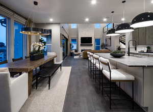 Dining space featuring dark wood-style floors and recessed lighting