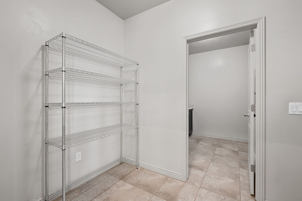 Bathroom featuring baseboards and light tile patterned flooring