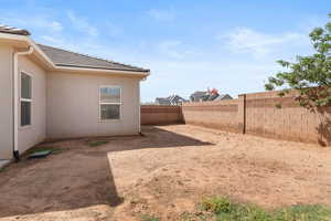 View of fenced backyard