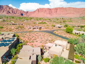 Aerial view of a mountainous background and a desert landscape