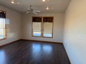 Spare room featuring plenty of natural light, wood finished floors, recessed lighting, and a ceiling fan