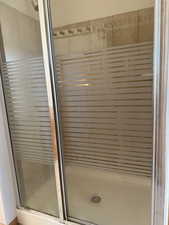 Full bathroom with a stall shower