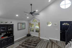 Entrance foyer featuring recessed lighting, light wood-style floors, high vaulted ceiling, stairs, and a ceiling fan
