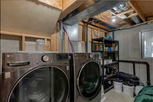 Laundry area with washing machine and clothes dryer