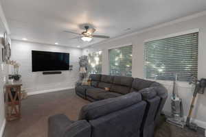 Living area featuring ornamental molding, ceiling fan, and recessed lighting