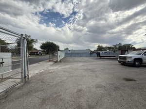 View of asphalt road with a gate