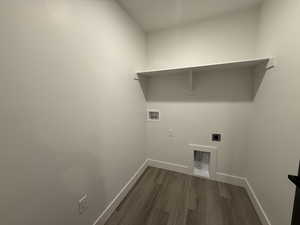 Laundry area featuring washer hookup, dark wood-style floors, and hookup for an electric dryer