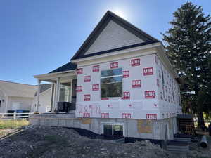 View of home's exterior featuring covered porch
