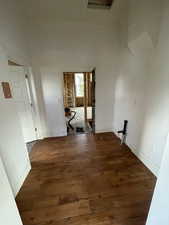 Corridor with dark wood-type flooring