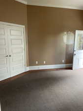 Unfurnished room with ornamental molding