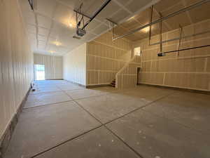 Garage featuring a garage door opener